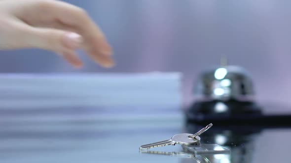 Woman Taking Key With Hotel Keychain at Reception Desk, Luxury Spa Resort