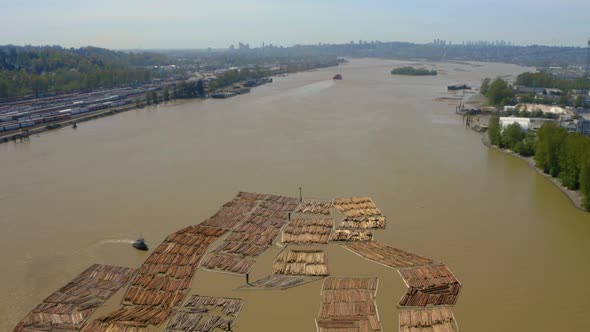 Aerial view of log booms floating in the Fraser River in Vancouver, British Columbia.