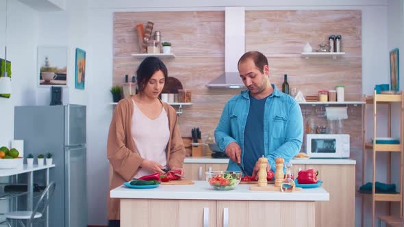 Couple Cutting Fresh Vegetables