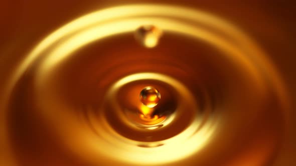 Super Slow Motion Shot of Droplet Falling into Alcohol Liquid at 1000fps.