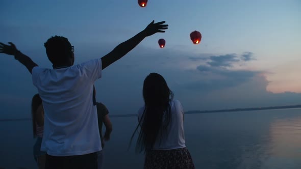 Group of Friends Looking at Sky Lanterns