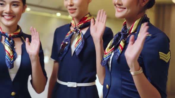 Cabin Crew Waving Hand for Greeting or Goodbye