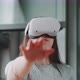 Young woman enjoying virtual reality experience in goggles - VideoHive Item for Sale
