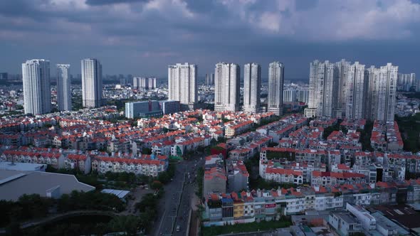 Aerial shot of modern urban and high rise development area of Ho Chi Minh City, Vietnam with dramati