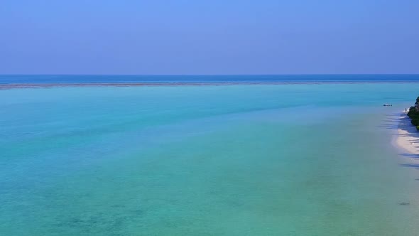 Drone view panorama of bay beach trip by blue water with sand background