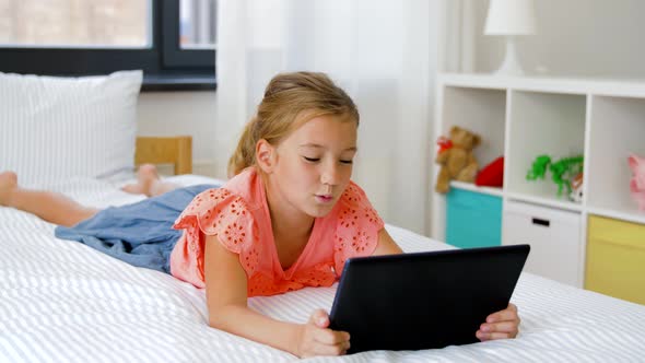 Girl Having Vide Call on Tablet Computer at Home