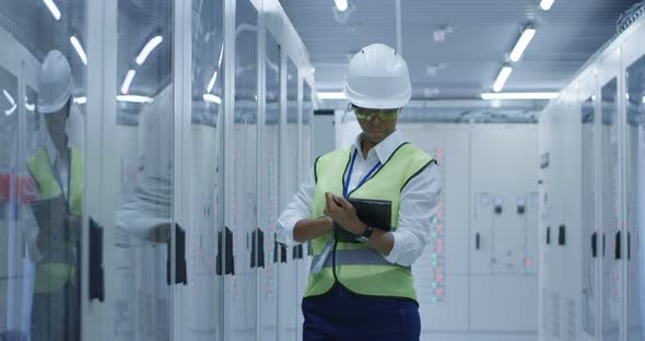 Female Electrical Worker Performing an Inspection