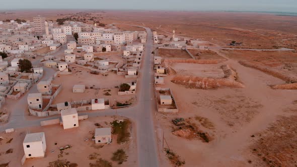 aerial shot of empty road in an old empty city in the desert in palestine near Gaza