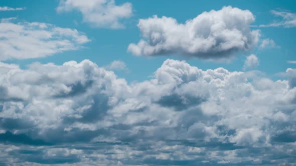 Summer Clouds Float Across the Blue Sky in Shuttles Shape Timelapse