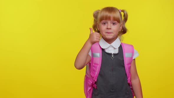 Smiling Cute Schoolgirl Kid with Backpack Looking at Copy Space for Promotional Content Holding Hand