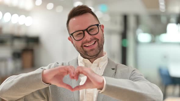 Creative Man Showing Heart Gesture