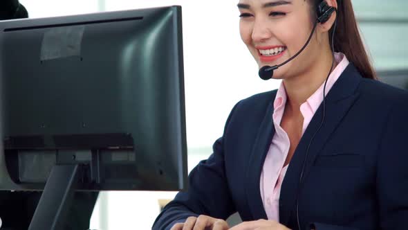 Business People Wearing Headset Working in Office