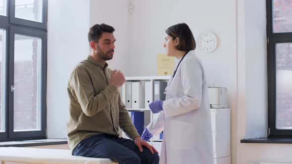 Doctor Checking Male Patient's Throat at Hospital