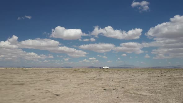 Orbiting White Pickup In Middle Of Plains 