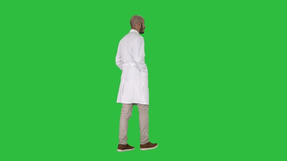 Walking Doctor in A Robe on A Green Screen, Chroma Key.