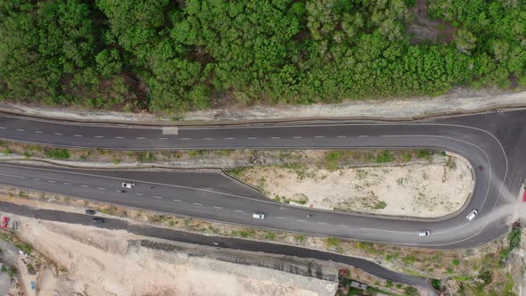 Motion Above Serpentine Highway Turn with Driving Cars