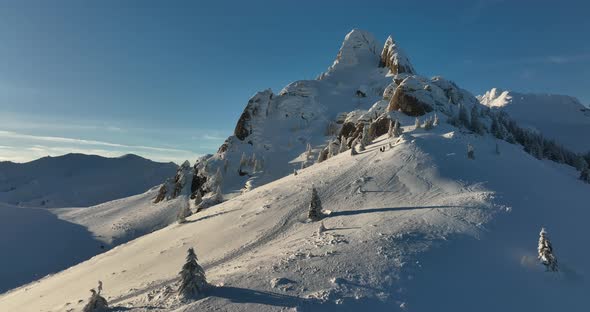 Fly Over and Around the Mountains of Ciucas Romania in January 2022 Sunny Day