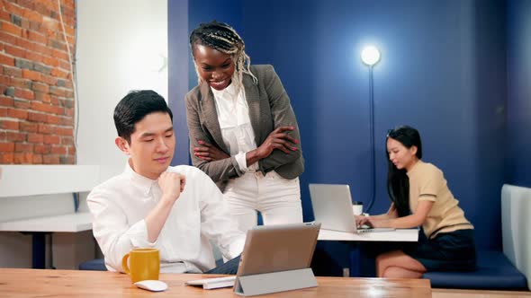 Business executives having discussion over digital tablet