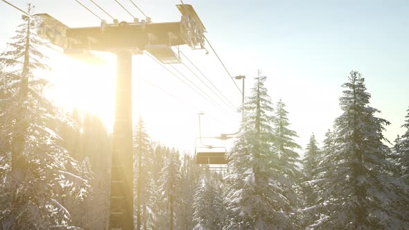 Empty Ski Lift. Chairlift Silhouette on High Mountain alt