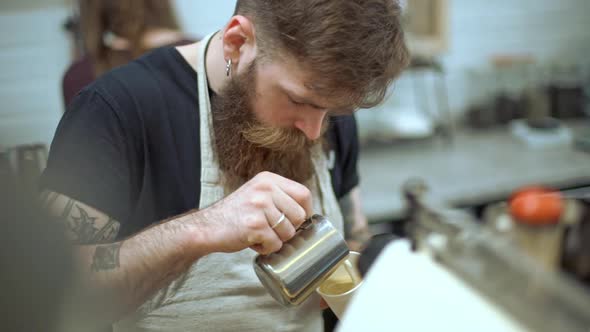 Barista Making Coffee in Coffeeshop