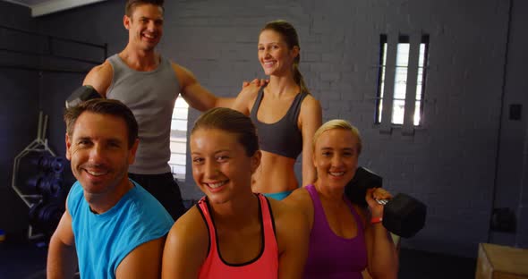 Group of people sitting with fitness equipment