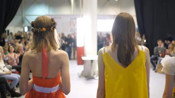 Four Girls Posing on Fashion Week Show Stage