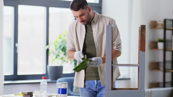 Man Painting Old Table in Grey Color at Home