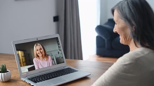Middleaged Woman Using Laptop for Video Call
