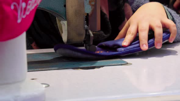 Sewing the leather with thread on the Sewing Machine, Close Up 4K