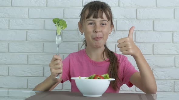 Child with broccoli.