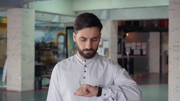 A Man Looks at the Clock and Worries