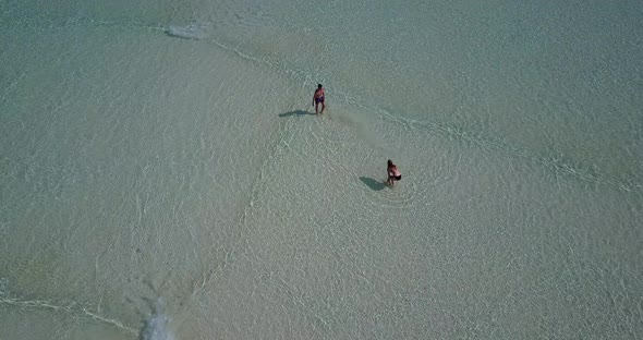 Fun man and woman married on vacation live the dream on beach on summer white sandy background 