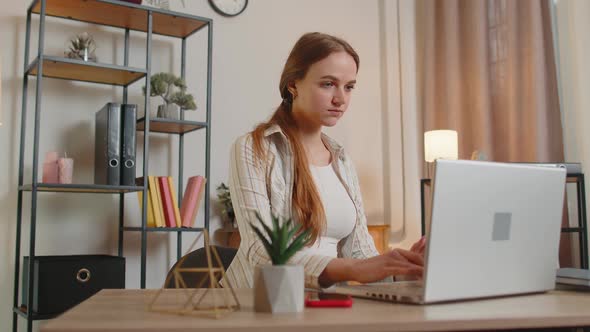 Young Woman Girl Using Laptop Computer Sitting at Table Working Online Shopping From Home Office