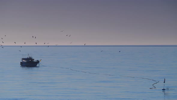 Fishing Boat on Sea in the Morning