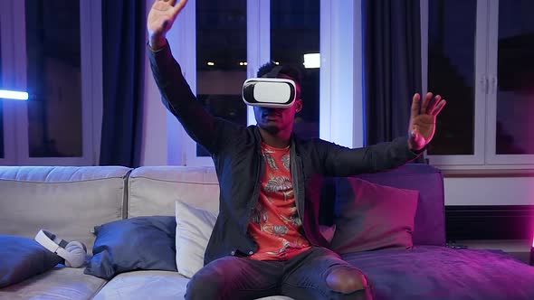 Modern Black-Skinned Guy in Special 3d Glasses Moving Hands on Virtual Screen