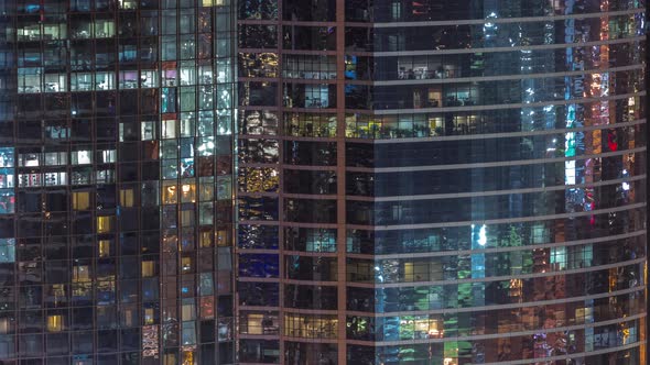 Windows in Highrise Building Exterior in the Late Evening with Interior Lights on Timelapse