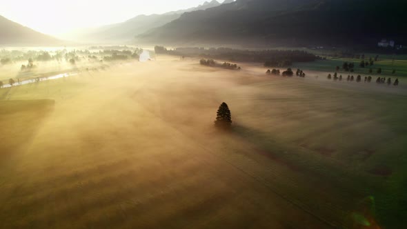 Drone Over Misty Sunlit Landscape Of Zell Am See