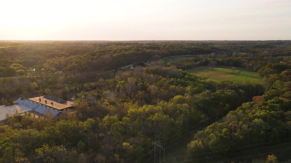 Flat Tree-Covered Landscape of Kansas. Aerial Sunset Drone View