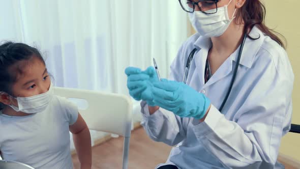 School Girl Visits Skillful Doctor at Hospital for Vaccination