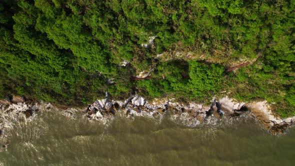 4K aerial top view, coast of mountains by the sea