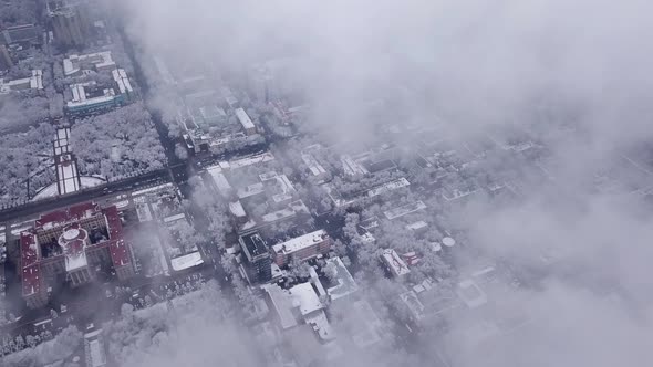 Top View Through the Clouds on the City of Almaty