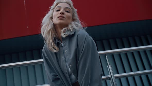 Beautiful Model Looking Camera at City Background in Downtown Street