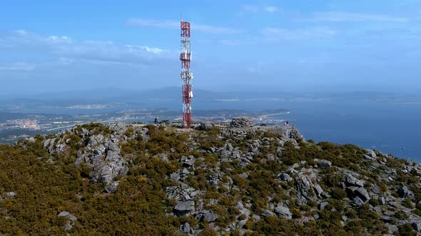 Aerial View Of Telecommunications Mast On Rocky Hillside In Miradoiro da Curota With Ria de arousa I