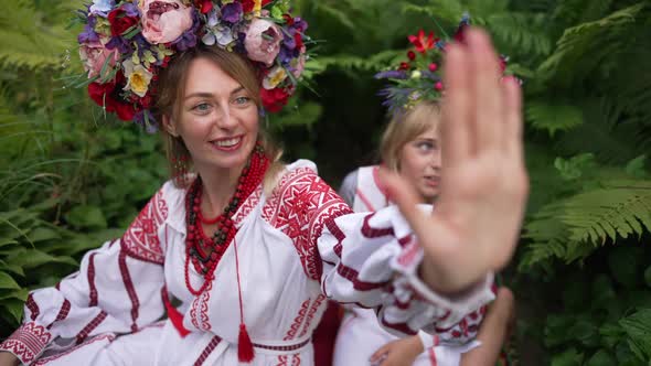 Beautiful Young Woman in Traditional Ukrainian Clothing and Little Pretty Girl in National Dress