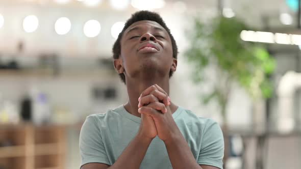 Young African Man Praying Forgiveness