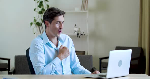 Young Funny Manager, Businessman Fooling Around in Office Sitting at Laptop, Dancing in Workplace