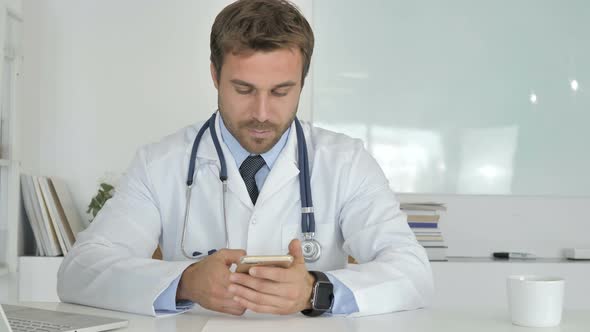 Doctor Using Smartphone in Clinic