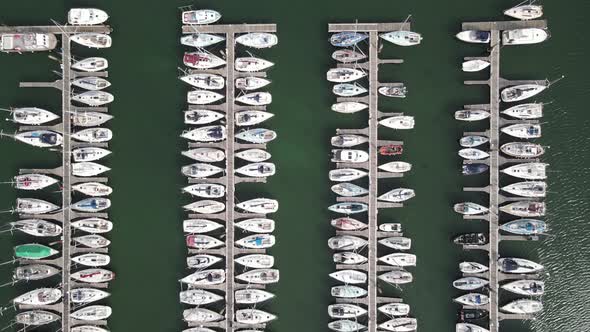 Boats Docked At Howth Harbour In Dublin, Ireland. aerial drone, top-down