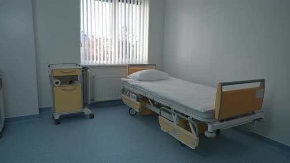 Hospital Ward with Modern Patient's Bed in Hospital Indoors