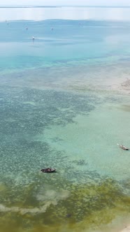 Vertical Video Boats in the Ocean Near the Coast of Zanzibar Tanzania